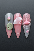 Macro close-up 3D sculpted lotus flower press-on nails pink dramatic lighting custom press-on nails — LuxepressCo
