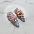 Macro close-up blush ombre 3D floral press-on nails glossy texture gold accents — LuxepressCo