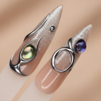 Macro close-up silver chrome liquid metal wire and iridescent abalone gem salon-quality press-on nails nude beige — LuxepressCo