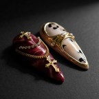 Close-up macro burgundy marble gold chain rhinestone cross charm pendant stiletto custom press-on nails dramatic — LuxepressCo