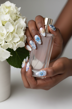 Dark skin lifestyle blue aurora floral almond custom press-on nails inclusive beauty — LuxepressCo