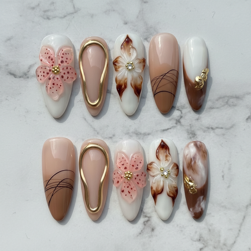 Flat lay top-down full set 10 luxury 3D floral custom press-on nails nude brown marble — LuxepressCo