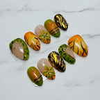 Full set orange green wild chrome press-on nails on white marble studio light custom press-on nails — LuxepressCo