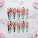 Flat lay top-down full set 10 3D cherry blossom mint green salon-quality nails white marble — LuxepressCo