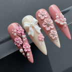 Macro close-up 3D pink floral butterfly rhinestone press-on nails dramatic dark background custom press-on nails pearl embellishment — LuxepressCo