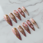 Hero shot full set 10 luxury 3D gold filigree pink floral stiletto custom press-on nails white marble background — LuxepressCo
