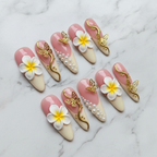 Hero studio shot full set 10 pink plumeria gold butterfly pearl custom press-on nails white marble — LuxepressCo