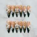 Flat lay top-down full set 10 luxury stiletto press-on nails 3D white floral gold swirl marble background custom press-on nails — LuxepressCo