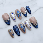 Navy blue chrome gold 3D frame butterfly press-on nails hero shot white marble studio — LuxepressCo