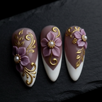 Close-up macro 3D mauve purple flower pearl center gold baroque filigree scroll white French tip custom press-on nails dramatic — LuxepressCo