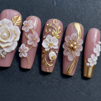 Close-up macro 3D white rose pearl gold custom press-on nails dramatic lighting — LuxepressCo