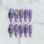 Flat lay top-down full set 10 purple butterfly floral custom press-on nails white marble studio — LuxepressCo