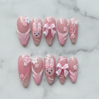 Flat lay top-down full set 10 pink bunny blossom reusable salon-quality press-on nails — LuxepressCo