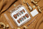 Luxury unboxing acrylic box brown rhinestone boho press-on nails with accessories on caramel linen — LuxepressCo