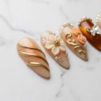 Macro close-up champagne nude gold foil stripe 3D white flower custom press-on nails marble — LuxepressCo