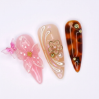 Macro close-up nude gold 3D flower 3D butterfly pink salon-quality nails — LuxepressCo