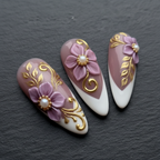 Macro close-up 3D purple floral pearl baroque gold filigree custom press-on nails dramatic lighting — LuxepressCo