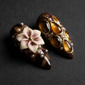 Macro close-up 3D ivory flower amber resin panels custom press-on nails tortoiseshell dark brown gold — LuxepressCo