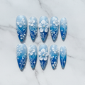 Flat lay top-down full set 10 blue ombre 3D floral pearl custom press-on nails overhead studio — LuxepressCo