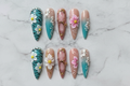 Flat lay top-down full set 10 teal floral rhinestone custom press-on nails — LuxepressCo