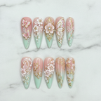 Flat lay top-down full set 10 3D pink butterfly gold baroque floral pearl salon-quality nails white marble — LuxepressCo