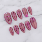 10-piece pink chrome heart coquette almond press-on nails full set on marble studio hero shot — custom press-on nails — LuxepressCo