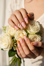 Fair-skin lifestyle matte pink orange glitter floral custom press-on nails holding white roses — LuxepressCo