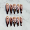 Flat lay top-down full set 10 burgundy orchid 3D floral stiletto custom press-on nails white marble — LuxepressCo