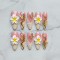 Flat lay top-down full set 10 pink plumeria butterfly pearl gold custom press-on nails white marble — LuxepressCo