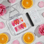 Luxury unboxing acrylic nail box pink orange swirl floral press-on nails with orange slices and rose petals — LuxepressCo