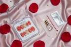 Luxury unboxing acrylic box red jelly floral heart press-on nails with accessories on blush satin — LuxepressCo