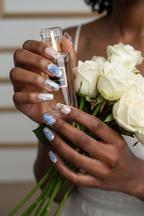 Lifestyle dark skin blue floral nails