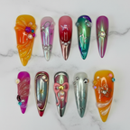 Maximalist chrome jelly chameleon custom press-on nails flat lay overhead marble — LuxepressCo